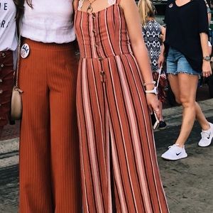 Pink jumpsuit ties in the back